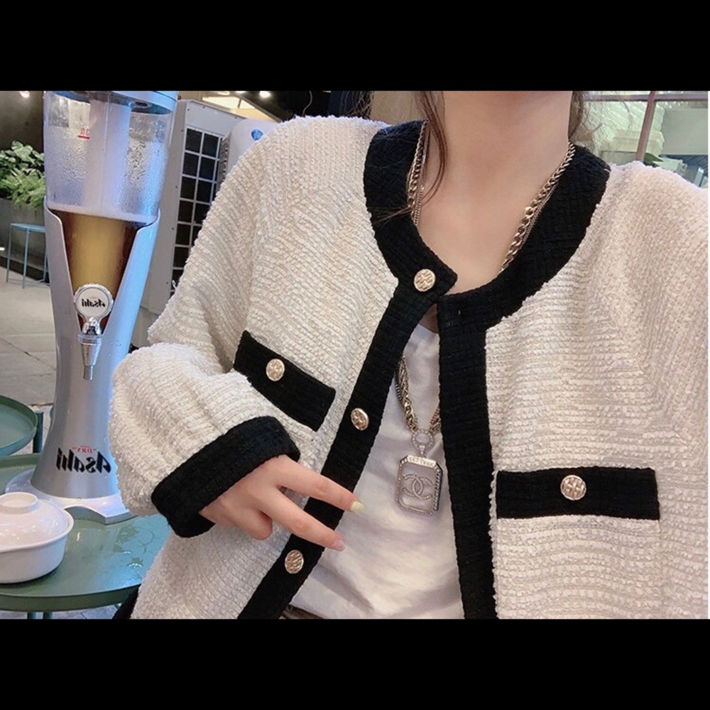 White bomber jacket with black trim